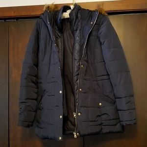 Black puffy jacket with faux fur hood